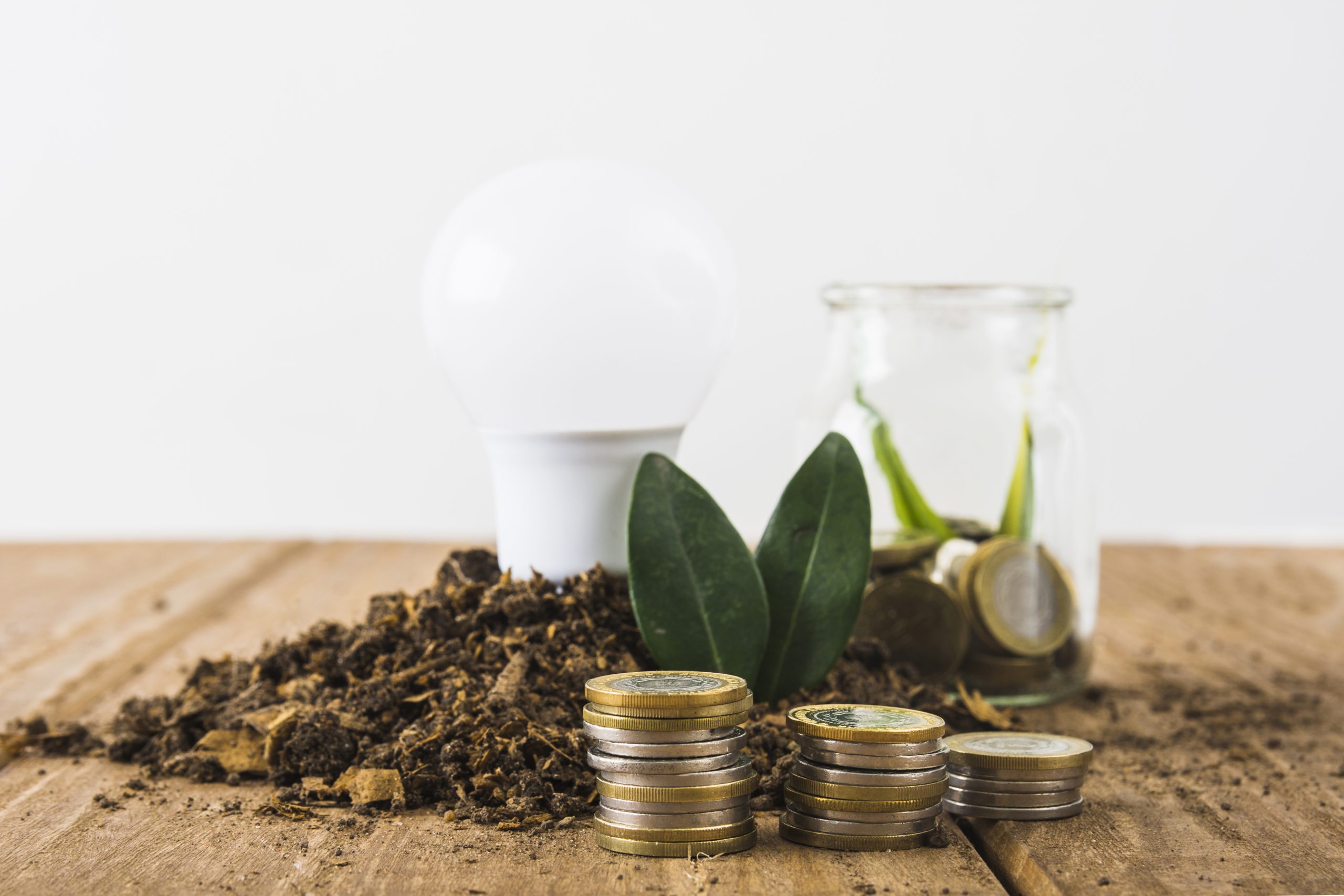 coins-stack-with-light-bulb-jar